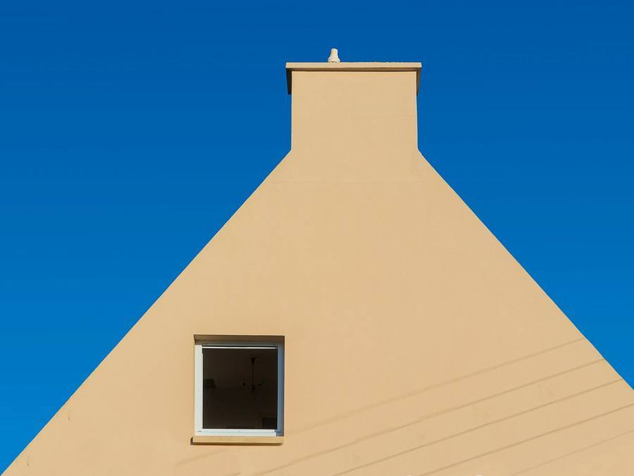 A through-coloured rendered UK home