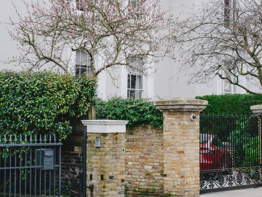 A bright white rendered home — the look that rewards a little regular care