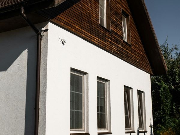 Painted sand and cement render on a UK home